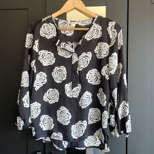 small black shirt with white roses